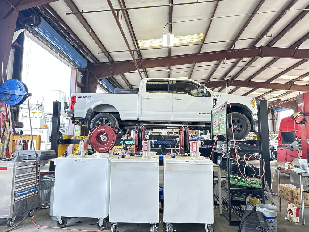 Pickup truck on a lift in the shop at Bonafide Truck and Equipment Repair, Cherry Valley, CA